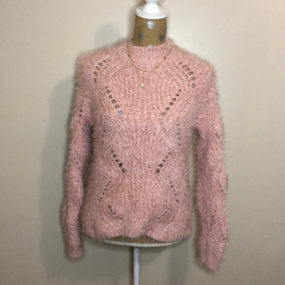 Cute fluffy pink sweater.